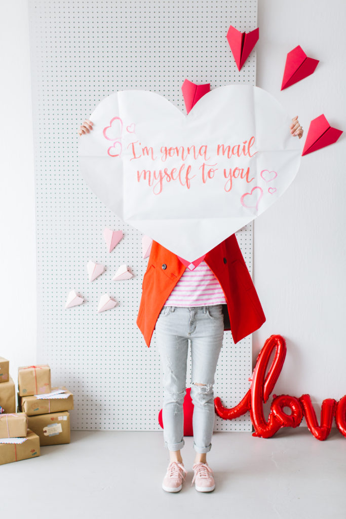 Valentine's Day photo shoot inspiration featuring giant heart love letter