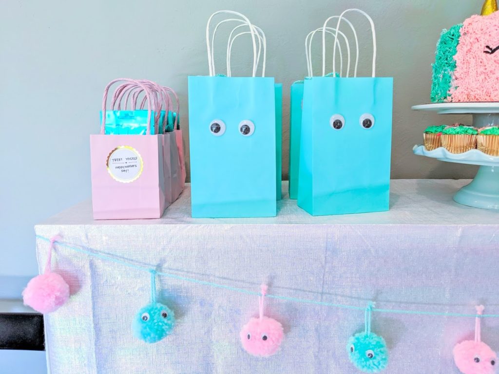 Googly eye goodie bags and pom poms.