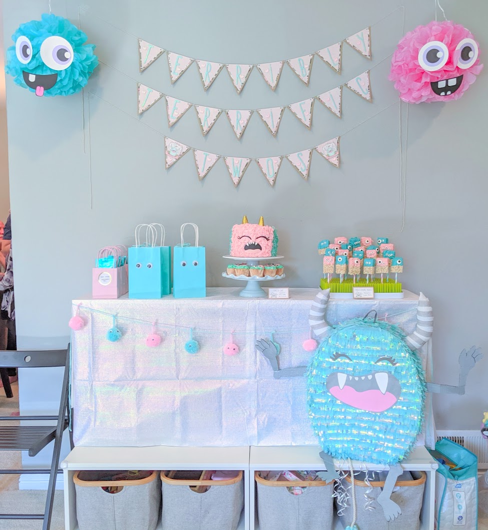 Terrible Twos Birthday Party Dessert Table with pink and turquoise monsters