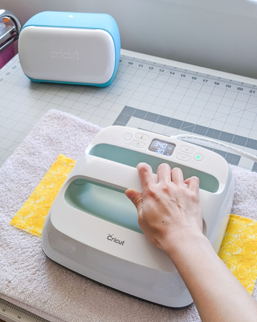 Using the Cricut EasyPress 2 to adhere the Smart Iron-On to fabric