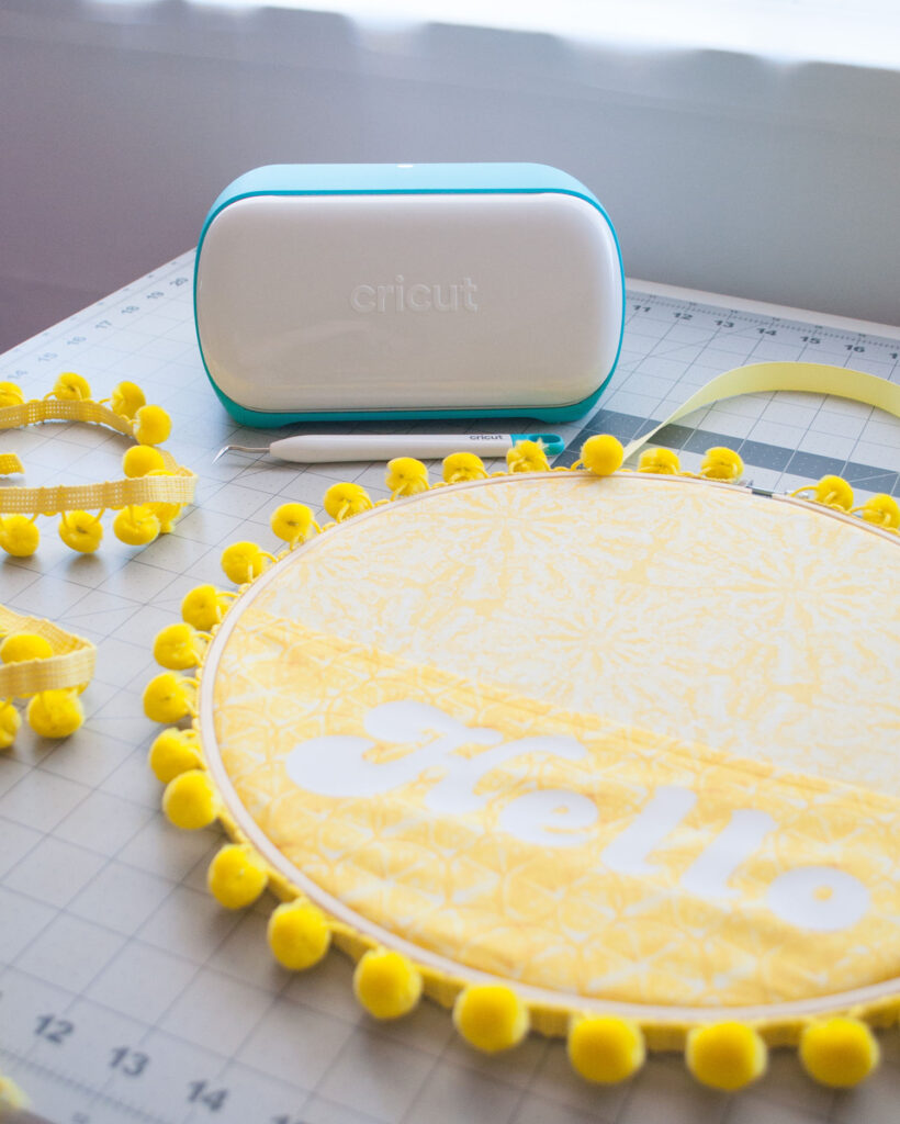 Cricut Joy machine with yellow sunshine front door decor