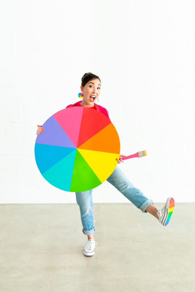 Blaire wearing a rainbow color wheel costume