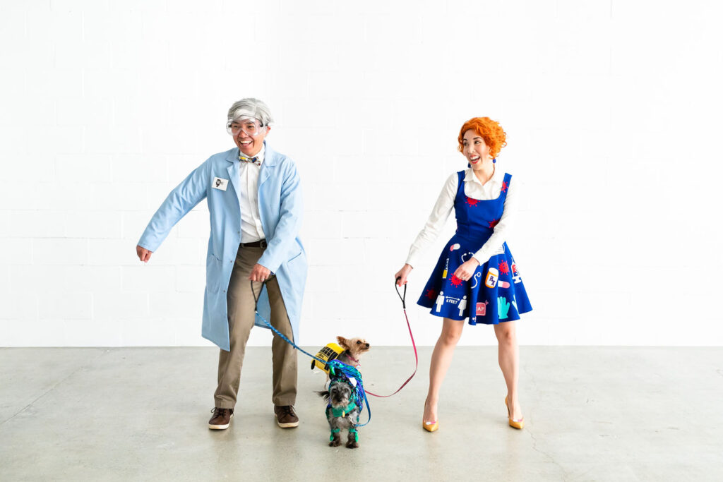 Couple dressed as Bill Nye and Ms. Frizzle dancing.