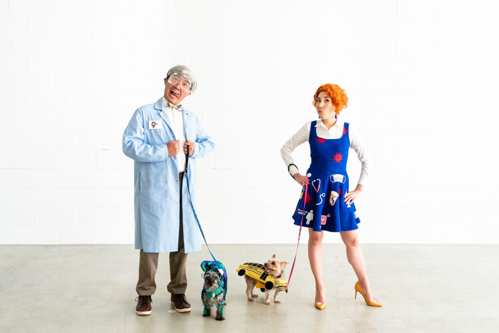 Couple dressed as Bill Nye and Ms. Frizzle making funny faces.