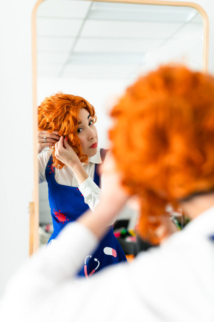Craft blogger fixing hair for DIY Ms. Frizzle costume