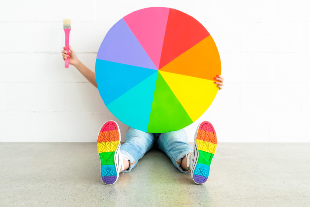 Rainbow color wheel costume with rainbow sneakers, part of colorful family costume.