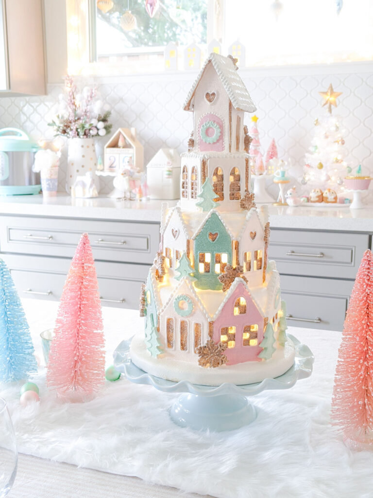 Close up of gingerbread village decor lit up.