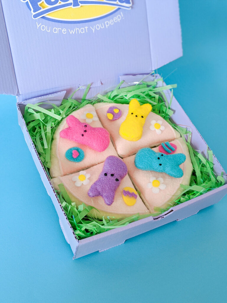 Close up of felt pizza with colorful Peeps bunnies