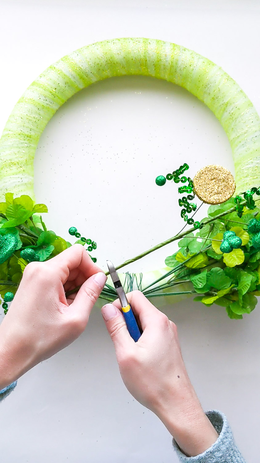 Cutting stem of shamrock spray pick. 