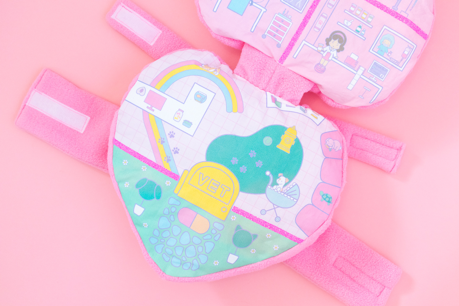 The bottom half of a Polly Pocket dog costume featuring an illustration of a pet hospital.